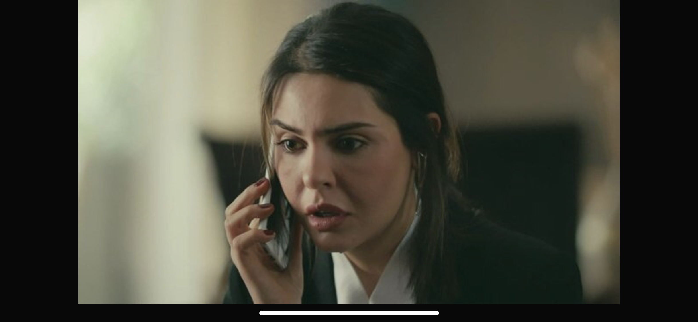 Masum Değiliz — A woman holding a phone to her ear; supplied screenshot includes a phone navigation bar.